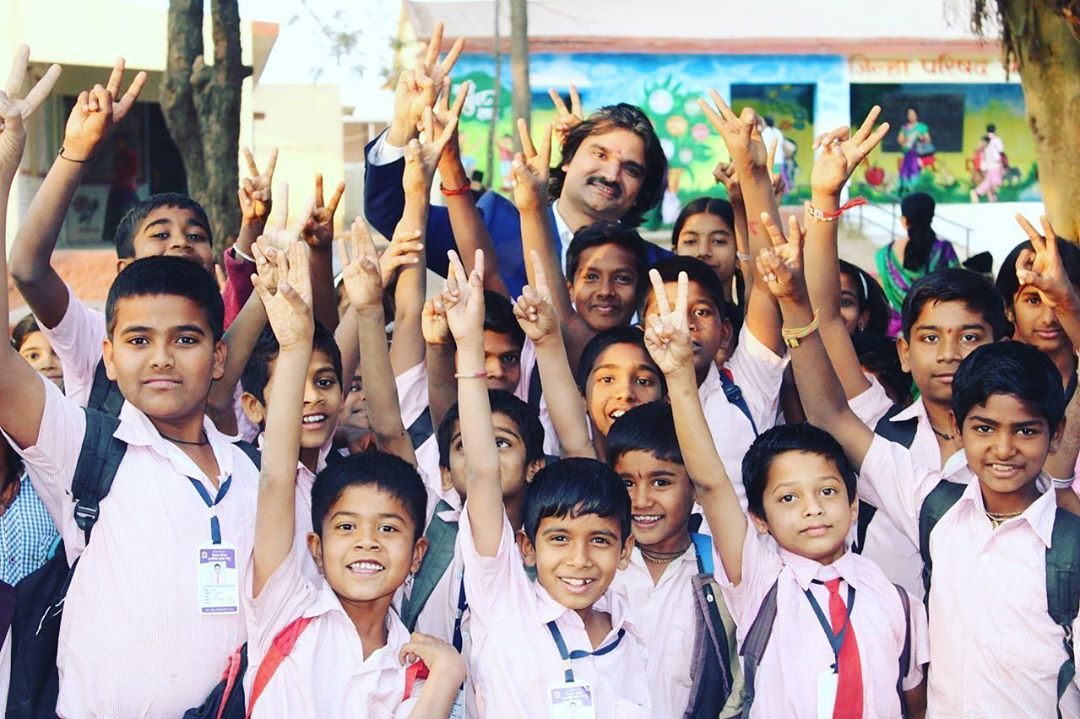 Santosh Talaghatti teaching in a rural classroom